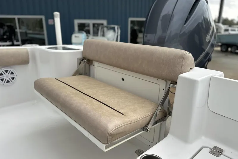 Slide: The Image of 2019 Sportsman Open 212 Center Console boat with beige cushioned seating. - 6