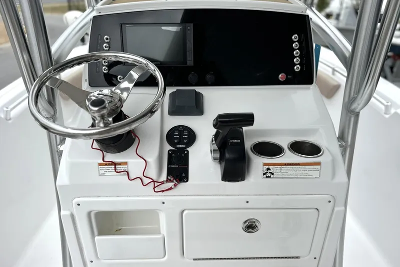 Slide: The Image of 2019 Sportsman Open 212 Center Console dashboard with steering wheel and controls. - 9