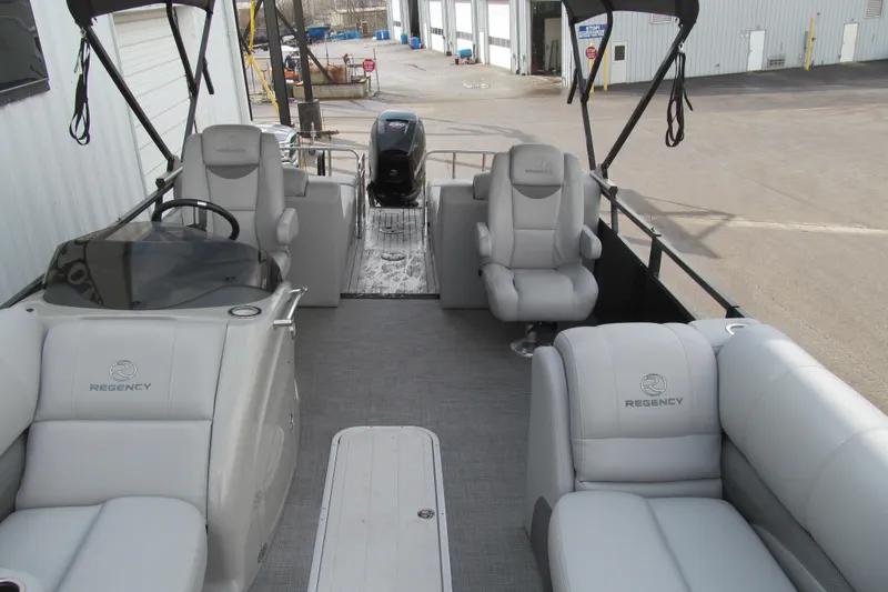 Slide: The Image of 2017 Regency 220 LE3 Sport pontoon boat with plush seating and modern design. - 10