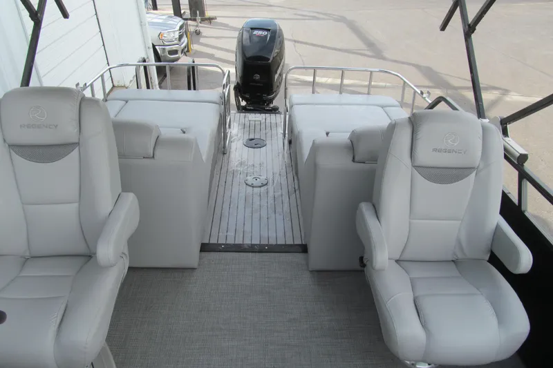 Slide: The Image of 2017 Regency 220 LE3 Sport boat interior with plush seating and modern design. - 11