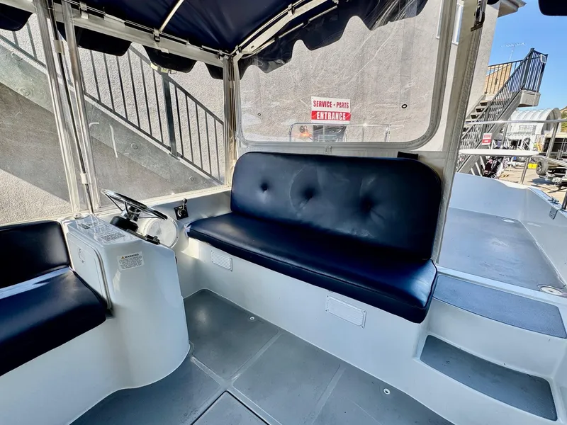 Slide: The Image of 2022 Duffy Sun Cruiser interior with navy seating and steering wheel. - 13