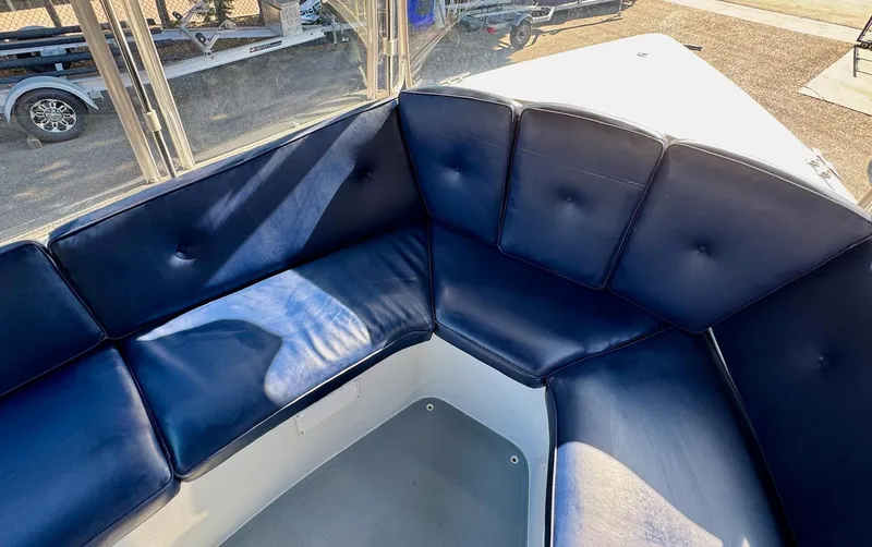 Slide: The Image of 2022 Duffy Sun Cruiser boat with blue cushioned seating in the cockpit area. - 20