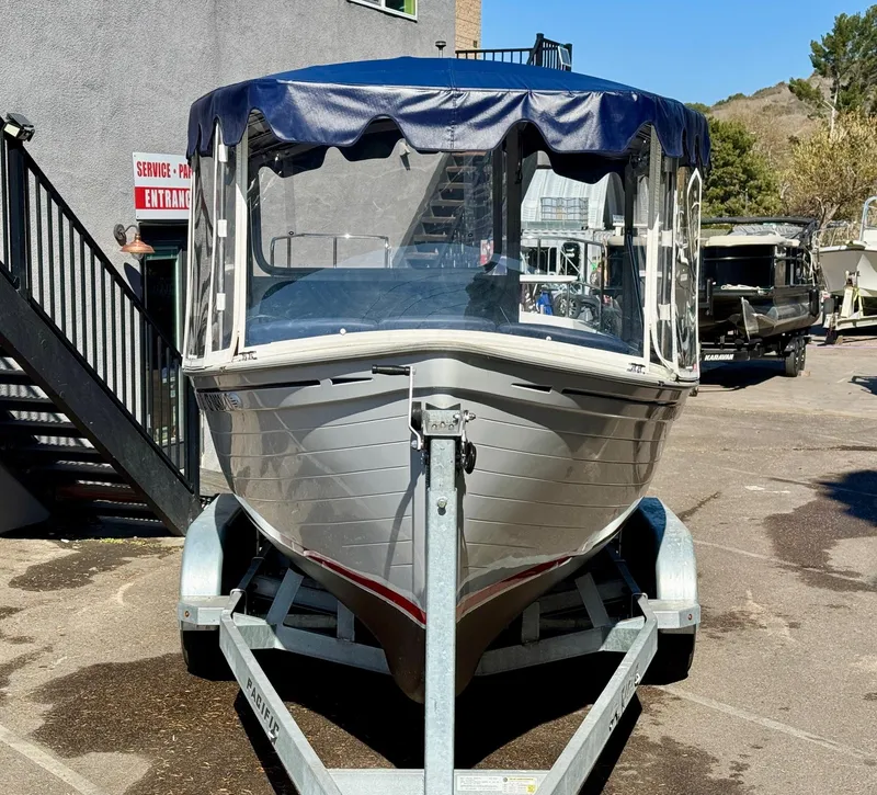 Slide: The Image of 2022 Duffy Sun Cruiser boat on trailer, parked outdoors with blue canopy. - 7