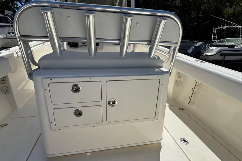 Slide: The Image of 2022 Cobia 237 Center Console boat interior with rod holders and storage compartments. - 22