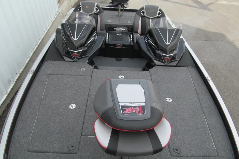 Slide: The Image of 2023 Ranger Z520R 55th Anniversary Limited Edition boat interior with sleek seating and storage. - 10