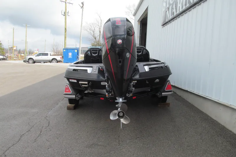 Slide: The Image of 2023 Ranger Z520R 55th Anniversary Limited Edition boat, rear view, parked outside a building. - 5