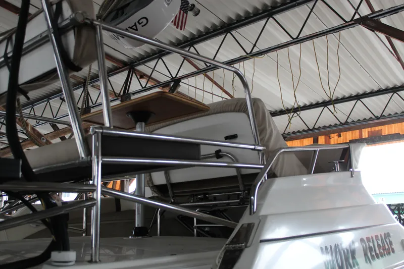 Slide: The Image of 2016 Cutwater 30 Command Bridge boat interior with metal railings and seating. - 3