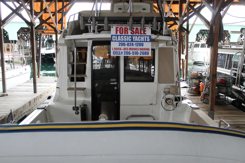 Slide: The Image of 2016 Cutwater 30 Command Bridge yacht for sale at marina dock. - 4