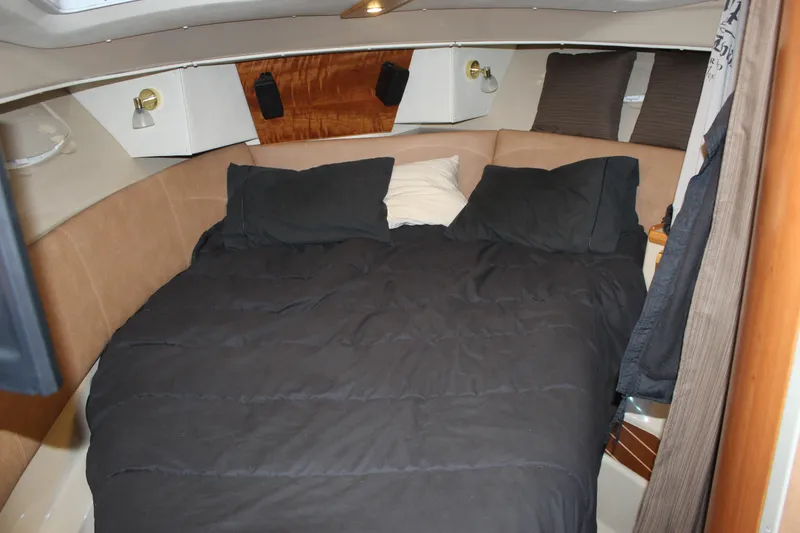 Slide: The Image of Cozy cabin interior of 2016 Cutwater 30 Command Bridge with comfortable bedding. - 7