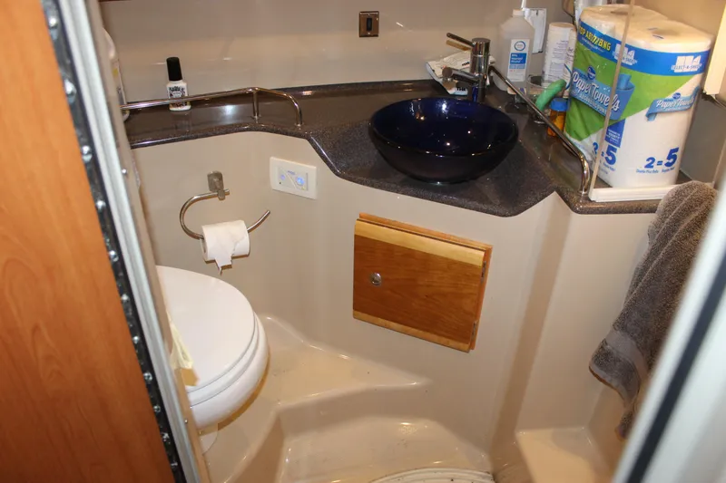 Slide: The Image of Compact bathroom in 2016 Cutwater 30 Command Bridge with modern sink and toilet. - 8