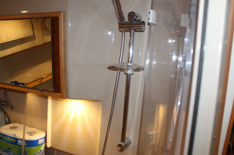 Slide: The Image of Bathroom interior of 2016 Cutwater 30 Command Bridge with shower and mirror. - 9