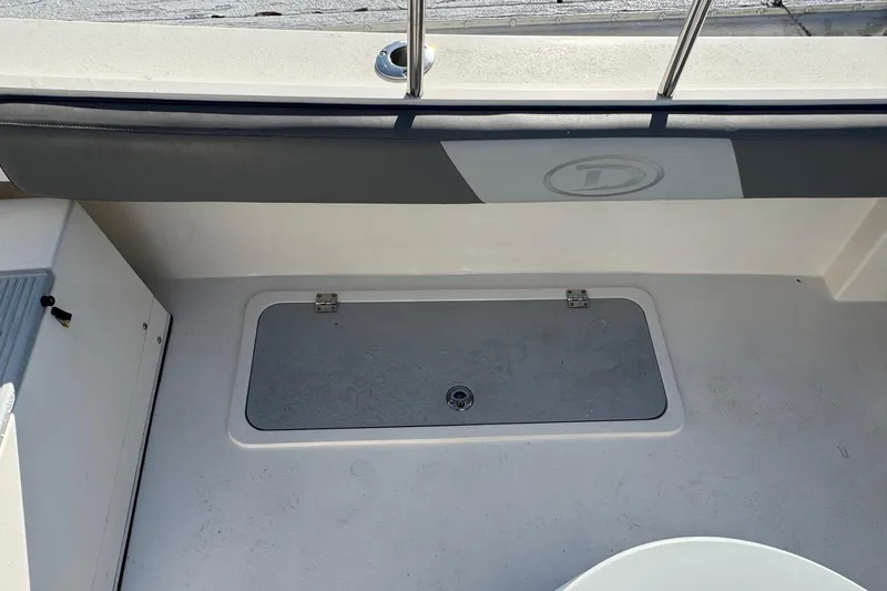 Slide: The Image of 2023 Defiance Admiral 220 EX boat deck with storage compartment. - 22
