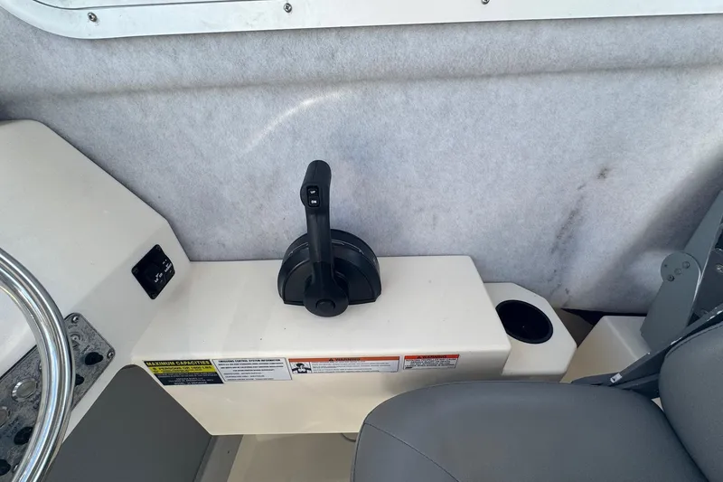 Slide: The Image of Control panel of 2023 Defiance Admiral 220 EX boat with throttle lever. - 46