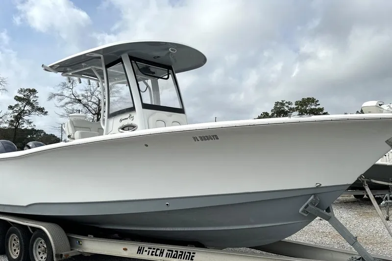 The Image of 2018 Sea Hunt Gamefish 27 boat on trailer, featuring forward seating and sleek design. - 0