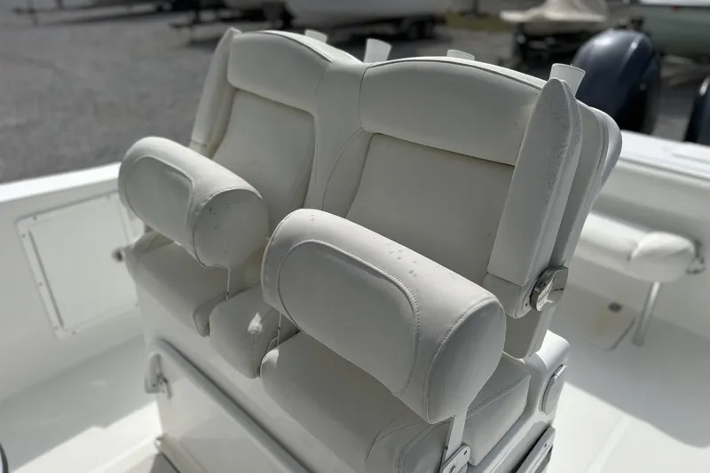 Slide: The Image of 2018 Sea Hunt Gamefish 27 boat with white forward seating and armrests. - 11
