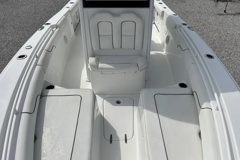 Slide: The Image of 2018 Sea Hunt Gamefish 27 Forward Seating boat interior with white cushioned seats. - 15