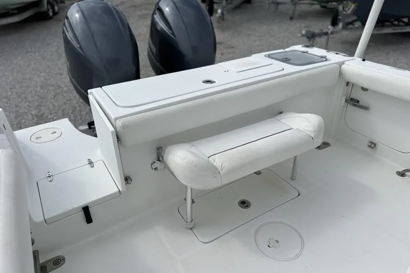 Slide: The Image of 2018 Sea Hunt Gamefish 27 boat interior with dual engines and seating. - 6