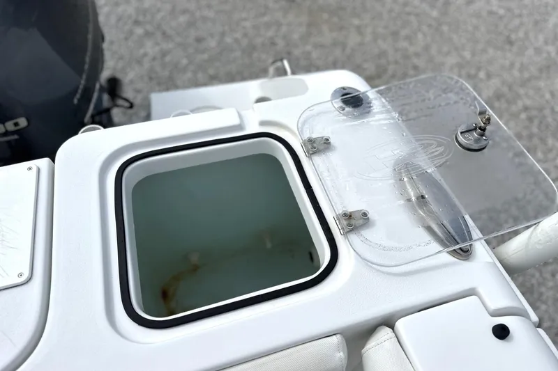 Slide: The Image of 2018 Sea Hunt Gamefish 27 livewell with transparent lid and secure latch. - 9