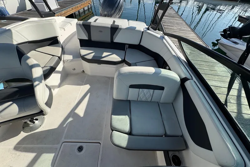 Slide: The Image of 2024 Regal 21 OBX boat interior with luxurious seating and modern design. - 13
