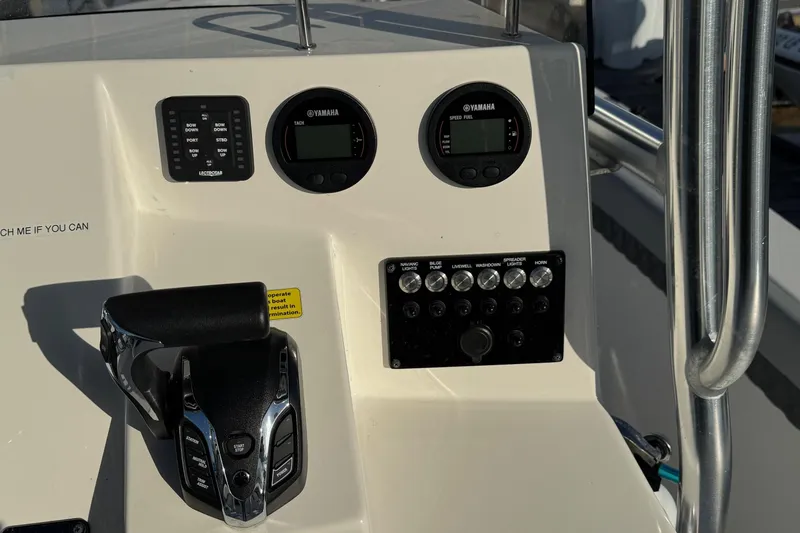 Slide: The Image of Control panel of 2025 Defiance Catalina 240 boat with Yamaha gauges and switches. - 27