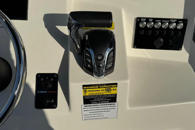 Slide: The Image of Control panel of 2025 Defiance Catalina 240 boat with Yamaha controls and capacity label. - 28