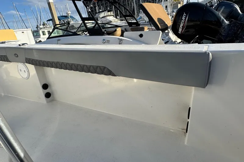 Slide: The Image of 2025 Defiance Catalina 240 boat interior with Mercury engine, docked at marina. - 40