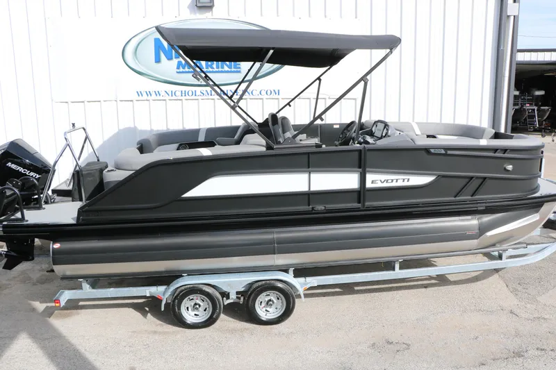 Slide: The Image of 2026 Evotti 521QL pontoon boat on trailer, featuring sleek design and Mercury engine. - 10
