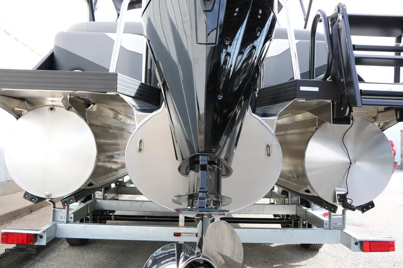 Slide: The Image of Rear view of 2026 Evotti 521QL pontoon boat on trailer, showcasing dual pontoons. - 16