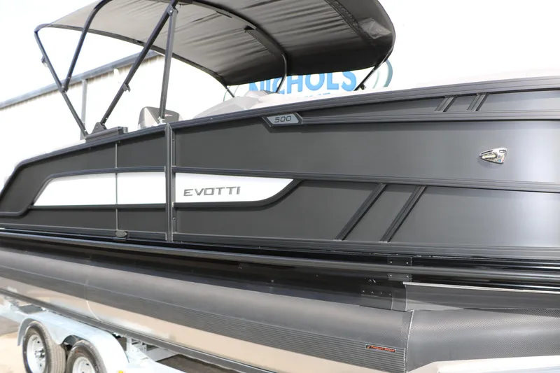 Slide: The Image of 2026 Evotti 521QL boat with sleek black design on a trailer. - 19