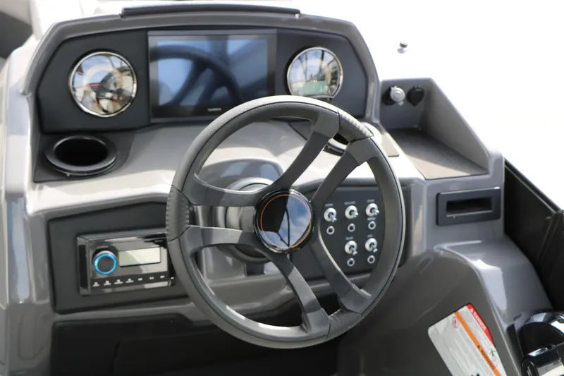 Slide: The Image of Steering console of 2026 Evotti 521QL boat with modern controls and display. - 38