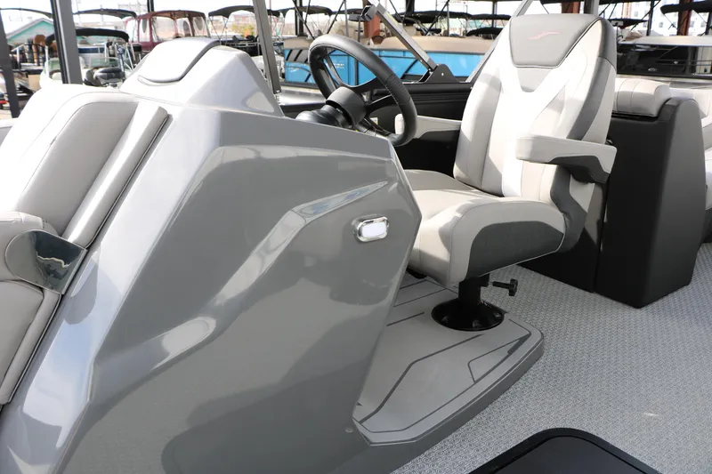 Slide: The Image of Captain's seat and helm of 2026 Evotti 521QL boat, featuring sleek design and modern controls. - 44