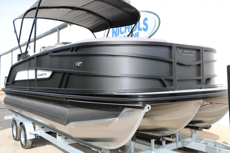 Slide: The Image of 2026 Evotti 521QL pontoon boat on trailer, sleek black design, outdoor setting. - 5