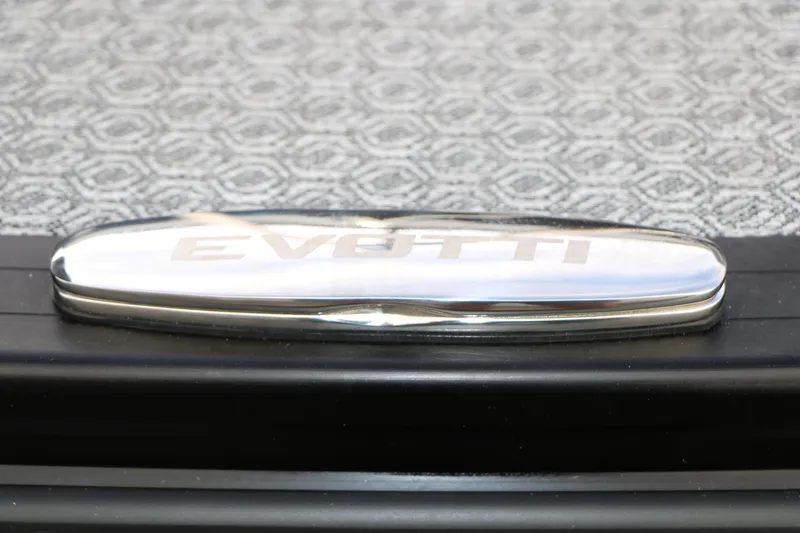 Slide: The Image of Chrome Evotti logo on patterned surface, 2026 Evotti 521QL model. - 54