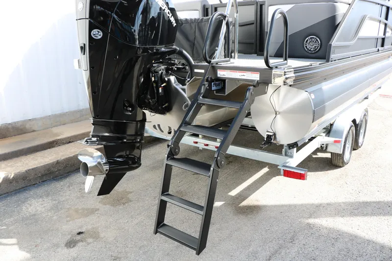 Slide: The Image of 2026 Evotti 521QL pontoon boat with outboard motor and trailer, featuring a rear ladder. - 56