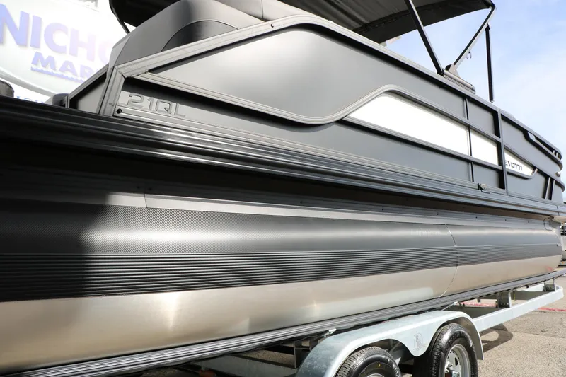 Slide: The Image of 2026 Evotti 521QL pontoon boat on trailer, showcasing sleek design and modern features. - 58