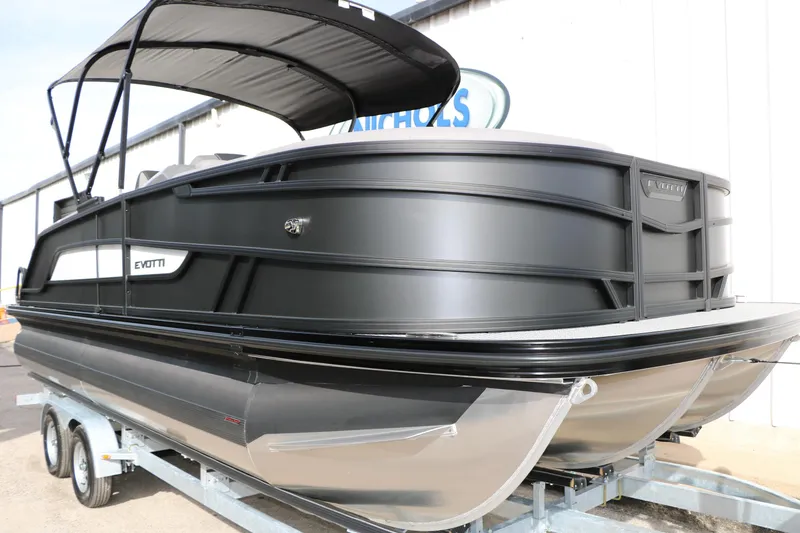 Slide: The Image of 2026 Evotti 521QL pontoon boat on trailer, featuring sleek black design and canopy. - 8