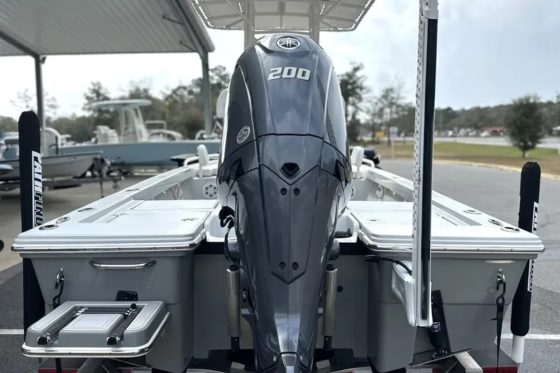 Slide: The Image of 2024 Pathfinder 2200 TRS boat with powerful 200 HP engine, docked outdoors. - 5