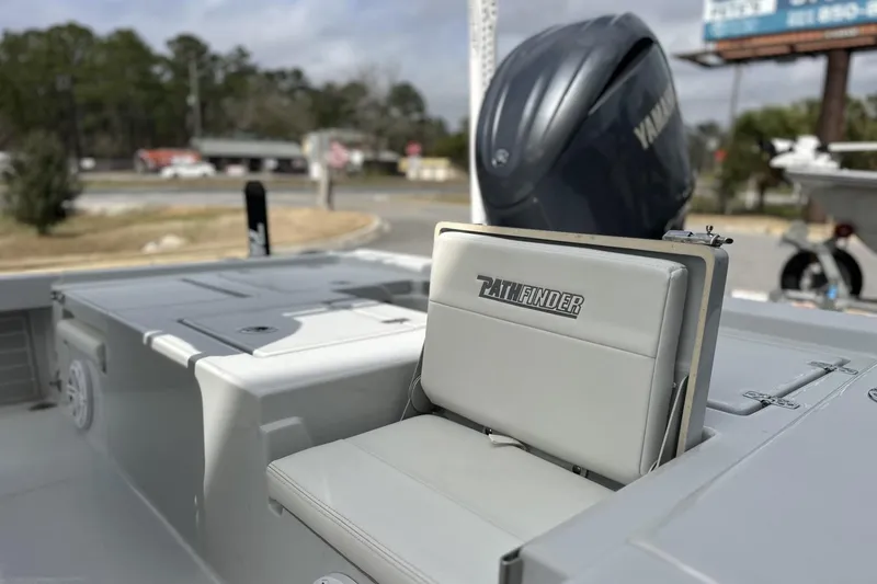 Slide: The Image of 2024 Pathfinder 2200 TRS boat with Yamaha engine, featuring sleek seating and storage. - 9