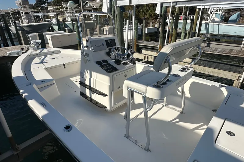 Slide: The Image of 2012 Pathfinder 2200 Tournament Edition boat at dock, featuring console and seating. - 10