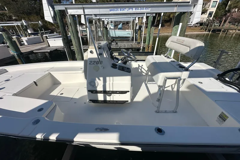 Slide: The Image of 2012 Pathfinder 2200 Tournament Edition boat interior with seating and console. - 5