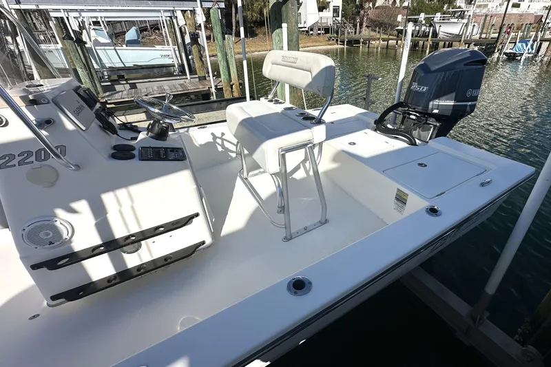 Slide: The Image of 2012 Pathfinder 2200 Tournament Edition boat with Yamaha engine, docked in marina. - 8