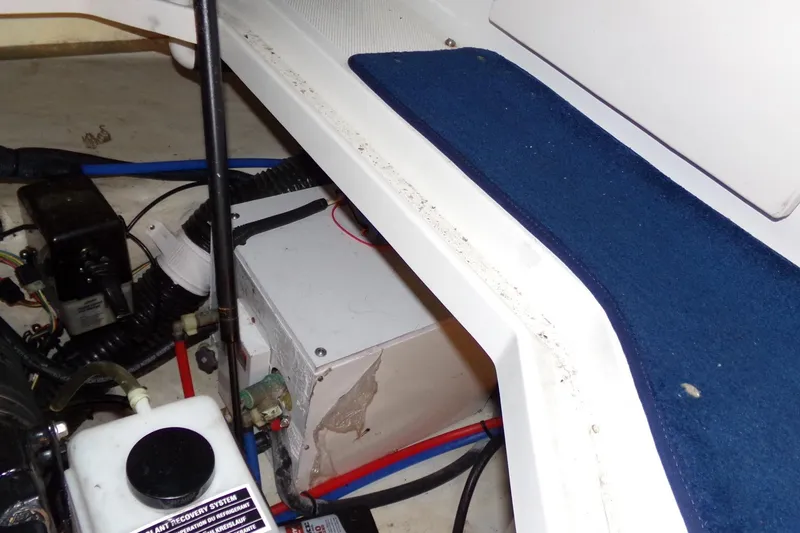 Slide: The Image of Engine compartment of a 2009 Searay Sundancer boat with visible components and wiring. - 18
