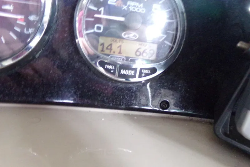 Slide: The Image of Close-up of 2009 Searay Sundancer boat dashboard with RPM gauge and digital display. - 7