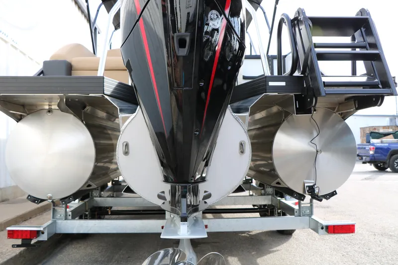 Slide: The Image of Rear view of 2026 Evotti 523CS pontoon boat on trailer, showcasing dual pontoons. - 11
