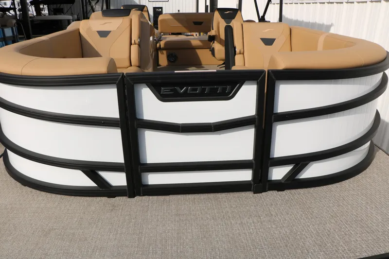 Slide: The Image of 2026 Evotti 523CS pontoon boat with beige seating and sleek black-and-white exterior design. - 14