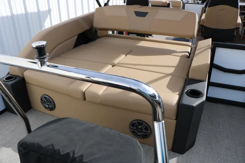 Slide: The Image of Luxurious seating area on 2026 Evotti 523CS boat with beige upholstery and cup holders. - 23