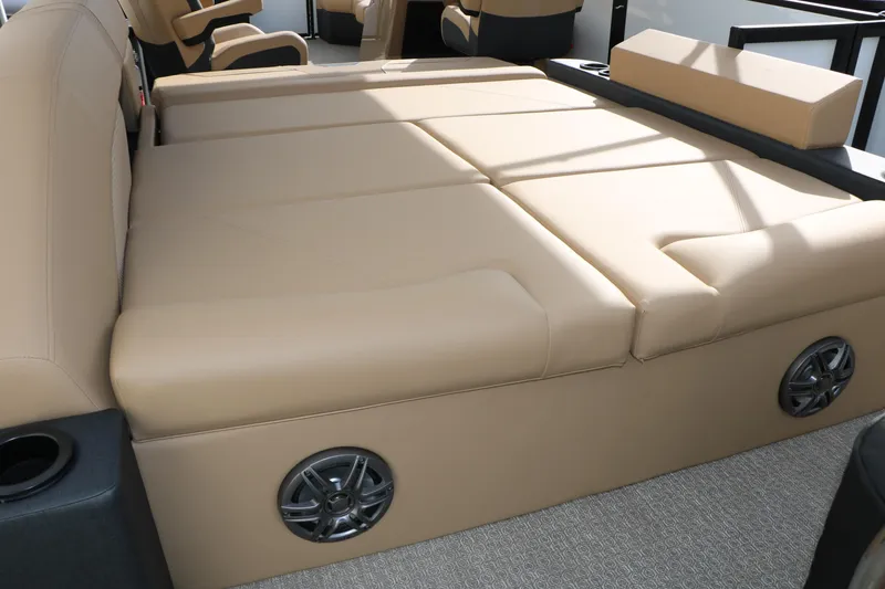 Slide: The Image of Luxurious beige seating in 2026 Evotti 523CS boat, featuring integrated speakers and cup holders. - 26