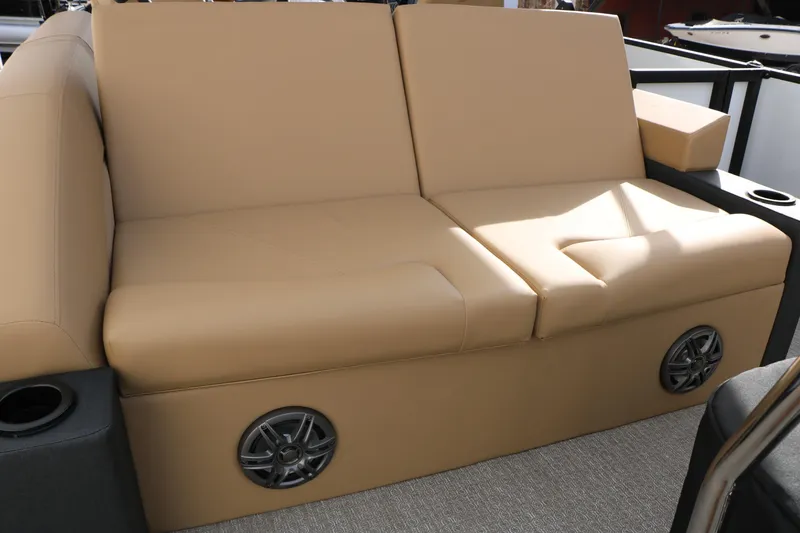 Slide: The Image of Beige seating on 2026 Evotti 523CS boat with built-in speakers and cup holders. - 28