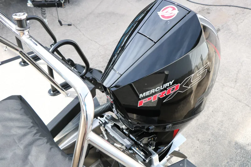 Slide: The Image of ```markdown Mercury Pro XS engine on 2026 Evotti 523CS boat, showcasing sleek design. ``` - 32