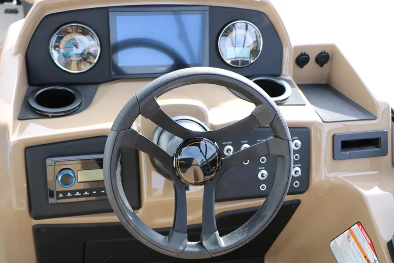 Slide: The Image of Steering console of 2026 Evotti 523CS boat with modern controls and display. - 37